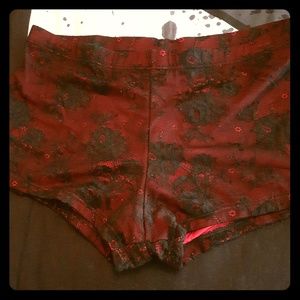 Sexy red hot pants covered in black lace